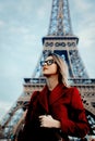 Girl in red coat and bag at parisian street Royalty Free Stock Photo