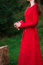 Girl in a red dress with a book