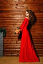 Girl in red dress with flowers Royalty Free Stock Photo