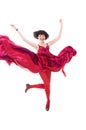 Girl in red dress flying in a jump Royalty Free Stock Photo