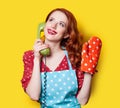 Girl in red dress with green dial phone Royalty Free Stock Photo