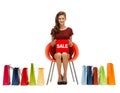 Girl in red dress with shoes, bag and sale sign Royalty Free Stock Photo