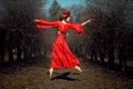 Girl in red dress soars. Royalty Free Stock Photo