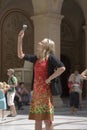 Girl in red dress taking picture at Montserrat, Santa Maria de Montserrat, near Barcelona, Spain