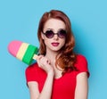 Girl in red dress with toy ice-cream Royalty Free Stock Photo