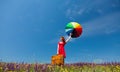 Girl in red dress with umbrella and suitcase Royalty Free Stock Photo