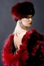 Girl in a red fur cap Royalty Free Stock Photo