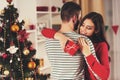 Girl with Red Gift Hugging Boyfriend.