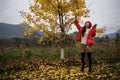 The girl in red and ginkgo leaf