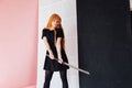 Girl cosplayer with red hair anime japan sword Royalty Free Stock Photo