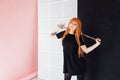 Girl cosplayer with red hair anime japan sword Royalty Free Stock Photo