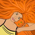 Girl with red hair hugs ginger cat with green eyes