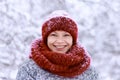 Girl in the red hat and a scarf having fun in the winter park Royalty Free Stock Photo