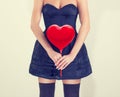 Girl with red hearts hands.