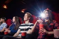 Girl in red holding popcorn in red cup. Royalty Free Stock Photo