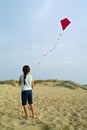 Girl and red kite Royalty Free Stock Photo