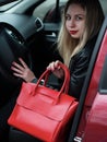 Girl with a red leather bag Royalty Free Stock Photo