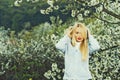 Girl with red lips and blonde hair in blossom Royalty Free Stock Photo