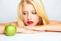 Girl with red lips and green apple Royalty Free Stock Photo