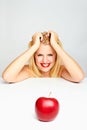 Girl with red lips and a red apple