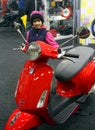 The girl with the red motorscooter