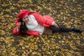 The girl in red overlie with ginkgo leaf