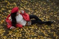 The girl in red overlie with ginkgo leaf Royalty Free Stock Photo