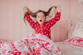 Girl in red pajamas sleeping in bed Royalty Free Stock Photo