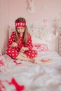 Girl in red pajamas sleeping in bed Royalty Free Stock Photo