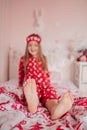 Girl in red pajamas sleeping in bed Royalty Free Stock Photo