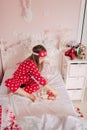 Girl in red pajamas sleeping in bed Royalty Free Stock Photo