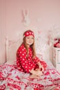 Girl in red pajamas sleeping in bed Royalty Free Stock Photo