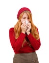 Girl in red sneezes and wipes her nose on a white isolated background Royalty Free Stock Photo