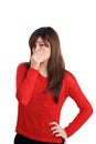 Girl in red with smelly gesture