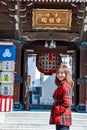 Girl in red suit in front of Kushida Shrine Royalty Free Stock Photo