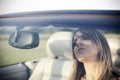 Girl is reflected in the rearview mirror Royalty Free Stock Photo