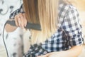 Girl reflection in the mirror, which makes the hair hairdresser., light toning