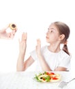 Girl refuses cake and chooses salad