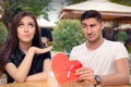 Girl Refusing Heart Shaped Gift From Her Boyfriend Royalty Free Stock Photo
