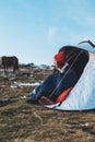 Girl relax in campsite, tourist in camp tent  trip on mountain nature, hiker woman enjoys  valley camping trip Royalty Free Stock Photo