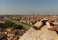 Girl relax near Castel San Pietro and Verona panorama with Adige River, Verona, Italy Royalty Free Stock Photo