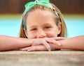 Girl, relax and portrait of kid in swimming pool with goggles for games outdoor on holiday or vacation. Calm, child and