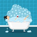 Girl relaxing in a bath and taking glass of wine. Royalty Free Stock Photo