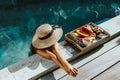 Girl relaxing and eating fruits in the pool on luxury villa in Bali Royalty Free Stock Photo