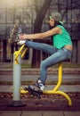 Girl relaxing on gym cycling machine Royalty Free Stock Photo