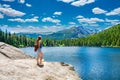 Woman standing on the rock looking at beautiful summer mountain landscape, Royalty Free Stock Photo