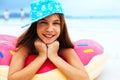 Girl relaxing with lilo on the beach Royalty Free Stock Photo