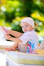 Girl relaxing near swimming pool