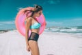 Girl relaxing on pink lilo on the beach Royalty Free Stock Photo