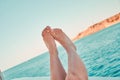 Girl relaxing on the yacht. Womans feet on the yacht